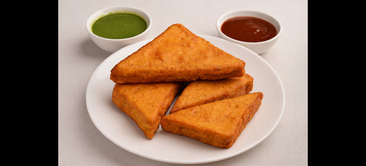crispy besan-coated bread pakora triangles served with green chutney and tea