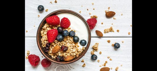 bowl of crunchy oat clusters with nuts, seeds and dried fruit