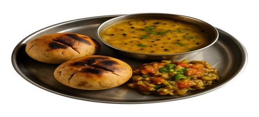 Rajasthani platter of baked baatis, spiced dal and sweet crumbly churma